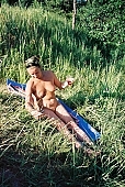 nudism, naturism, nudist, naturist, woman, naked, stripped, in a state of nature, in the buff, in the nude, nudity, nude, nakedness, body, nature, outdoors, without doors, sun, sunshine, recreation, relaxation, repose, rest, entertainment, grass, in the grass, Moscow, Russia, CD 0097