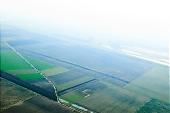 arable, clod, earth, field, ploughland, tillage, cultivation, grower, agriculture, agricultural land, air, aerial, air photograph, air photo, of the air, plan, soil, ground, parcel, plow, inland inundation, water, green, grass, nature, grain, cereals, cornfield, corn, brown, forest, dirt road, canal, hose-pipe, birds eye view, of birds eye view, Kiss L�szl�, L�szl� Kiss