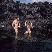 nudist couple, nudist pair, naked, stripped, naturist couple, naturist, holidays, nudist, on holiday, recreation, relaxation, repose, rest, rock coast, game, beach, coast, nudism, naturism, attitude, pose, posture, stony, craggy, bay, gulf, clear, hygienic, pure, clean, Hawaii, Kona, Honokohau, Queen s bath, 1987, man, woman, bath, bath, bathe, bathing, water, stone, stones, rock, scrag, bush, CD 0091