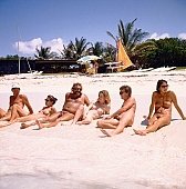 sun-bathing, sunbathing, naturism, naturist, naturist man, saunter, group, naturist lady, nudist, nudist lady, confab, talking, naturist woman, naturist girl, nudist man, St Martin, Club Orient, Orient, girl, woman, club, man, white, clouds, unclad, stripped, naked, sunbather, palm, palms, mountain, apex, apices, sky, wet, peace, affection, liking, love, unclothed, adult, nature, in the nature, blue, sand, with sand, island, coast, beach, sea, billows, deep, wind, hair, pie in the sky, naturist beach, laughing, laugh, smile, together, delight, zest for life, summer, recreation, relaxation, repose, rest, warm, water, wave, gale, 1988, CD 0034