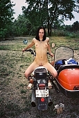motor, girl, naturism, young nudist, woman, young girl, modell, in a state of nature, in the buff, in the nude, naked body, nude body,  naked motorcyclist, nudism, young naturists, attitude, pose, posture, naked, stripped, unclad, photography, adjusment, red, sidecar, motor with a sidecar, holidays, Delegyhaza, CD 0095