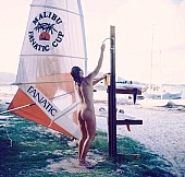 naturism, naturist, naturist lady, douche, shower-bath, nudist, nudist lady, naturist woman, sail, sailing, boat, naturist girl, St Martin, Club Orient, Orient, girl, woman, club, unclad, stripped, naked, sky, wet, peace, affection, liking, love, unclothed, adult, floor, storied, storeyed, nature, in the nature, blue, sand, island, beach, coast, sea, billows, deep, wind, hair, pie in the sky, laughing, laugh, smile, together, delight, zest for life, summer, recreation, relaxation, repose, rest, warm, water, gale, 1988, CD 0034, Malibu, Fanatic, Cup