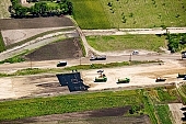highway, road making, air photograph, road, M5, E5, E75, Szeged, Budapest, air photo, Kecskemet, Kiskunfelegyhaza, Hungary, transportation, traffic, horticulture, barrier, bar, fence, birds eye view, banister, delimination, bridge, holiday home, holiday resort, holidaymakers, house, houses, overpass, perspective, nature, bridges, power-line, wire, fruit tree, plantation, electric line, car, cars, lane, lanes, painted lane, speed, range of speeds, fast, fast transportation, menacing, cloud, clouds, sky, cut, dike, ditch, pit, trench, water-jump, asphalt, bitumen, blacktop, concrete, standing, arc of a circle, arc, Kiss L�szl�, L�szl� Kiss