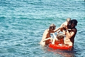 smile, naturist family, freik�rperkultur, nudist family, mattress, young naturist, young nudist, nudity, nude, nakedness, family, nature, air, sea, billows, deep, Honokohau, sand, regeneration, relaxation, siesta, short nap, in the nature, recreation, refection, game, reformation, reform, rejuvenation, parent, fkk, mother, wind, joung fkk, hair, man, Hawaii, repose, rest, beauty, bloom, reviving, tonic, on holiday, summer, co-operation, collaboration, naturism, naturist, naturist lady, nudist, nudist lady, naturist woman, naturist girl, girl, nudist girl, woman, unclad, stripped, naked, peace, affection, liking, love, adult, blue, red, beach, laughing, laugh, together, delight, zest for life, warm, 1986, CD 0035