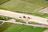 highway, road making, aerial, road, E5, E75, Szeged, Budapest, air photograph, air photo, Kecskemet, Kiskunfelegyhaza, Hungary, transportation, traffic, horticulture, barrier, bar, fence, birds eye view, banister, delimination, bridge, holiday home, holiday resort, holidaymakers, house, houses, overpass, perspective, nature, bridges, power-line, wire, fruit tree, plantation, electric line, car, cars, lane, lanes, painted lane, speed, range of speeds, fast, fast transportation, menacing, cloud, clouds, sky, cut, dike, ditch, pit, trench, water-jump, asphalt, bitumen, blacktop, concrete, standing, arc of a circle, arc, Kiss L�szl�, L�szl� Kiss