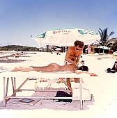 masseur, massage, recreation, refection, air, reviving, tonic, recovery, healing, recovery massage, sunlight, on the beach, white, clouds, beauty massage, reviving massage, siesta, short nap, reformation, reform, rejuvenation, relaxation, repose, rest, regeneration, muscle, waist, back, cosmetics, naturism, naturist, naturist lady, nudist, nudist lady, naturist woman, naturist girl, St Martin, Club Orient, Orient, club, girl, woman, unclad, stripped, naked, peace, affection, liking, love, unclothed, adult, blue, hair, beach, laughing, laugh, smile, together, delight, beauty shop, zest for life, warm, 1988, CD 0034, sand