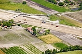 highway, aerial, road, E5, E75, Szeged, Budapest, air photograph, air photo, Kecskemet, Kiskunfelegyhaza, Hungary, transportation, traffic, horticulture, barrier, bar, fence, birds eye view, banister, delimination, bridge, house, houses, overpass, perspective, nature, bridges, power-line, wire, fruit tree, plantation, electric line, car, cars, lane, lanes, painted lane, speed, range of speeds, fast, fast transportation, menacing, cloud, clouds, sky, cut, dike, ditch, pit, trench, water-jump, asphalt, bitumen, blacktop, concrete, standing, arc of a circle, arc, Kiss L�szl�, L�szl� Kiss