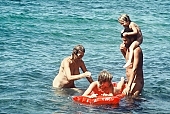 relaxation, siesta, short nap, sandcastle, sandcastle building, mother, smile, family, naturist family, joung fkk, fkk, naked, unclothed, nature, in the nature, Honokohau, sand, regeneration, parent, recreation, refection, game, reformation, reform, rejuvenation, air, sea, billows, deep, naturist man, nude man, nudist man, mattress, young naturist, joung nudists, wind, hair, man, Hawaii, repose, rest, beauty, bloom, reviving, tonic, on holiday, summer, co-operation, collaboration, naturism, naturist, naturist lady, nudist, nudist lady, naturist woman, naturist girl, girl, woman, unclad, stripped, peace, affection, liking, love, adult, blue, red, beach, laughing, laugh, together, delight, zest for life, warm, 1986, CD 0035