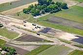 highway, road making, aerial, road, E5, E75, Szeged, Budapest, air photograph, air photo, Kecskemet, Kiskunfelegyhaza, Hungary, transportation, traffic, horticulture, barrier, bar, fence, birds eye view, banister, delimination, bridge, holiday home, holiday resort, holidaymakers, house, houses, overpass, perspective, nature, bridges, power-line, wire, fruit tree, plantation, electric line, car, cars, lane, lanes, painted lane, speed, range of speeds, fast, fast transportation, menacing, cloud, clouds, sky, cut, dike, ditch, pit, trench, water-jump, asphalt, bitumen, blacktop, concrete, standing, arc of a circle, arc, Kiss L�szl�, L�szl� Kiss