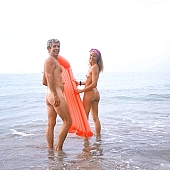 Kuna, USA, beach mattress, inflatable raft, short sea, adult, nature, in the nature, overcast, nudist lady, naturist woman, naturist man, nudist man, naturist couple, nudist couple, nudist pair, nudist, naturism, hand in hand, naturist, naturist lady, sea, billows, deep, sunbathing, coast, stones, silence, quiet, afternoon, clouds, island, background, summer, saunter, naturist girl, club, girl, woman, unclad, stripped, naked, sky, water, wet, wave, peace, affection, liking, love, nudity, nude, nakedness, blue, sand, sunlight, sunshine, beach, wind, hair, pie in the sky, laughing, laugh, smile, together, delight, zest for life, warm, recreation, relaxation, repose, rest, on holiday, refection, swim, CD 0038, Kiss Lszl, Lszl Kiss