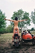 motor, naked body, nude body,  naked motorcyclist, nudism, naturism, girl, young naturists, young nudist, attitude, pose, posture, naked, stripped, unclad, modell, photography, adjusment, red, sidecar, motor with a sidecar, holidays, Delegyhaza, CD 0094