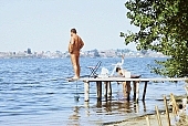 naturist, nudist, Hungary, Delegyhaza, 1988, naturist woman, naturist man, nudist women, nudist man, naturist girl, girls, naturist family, young, mother, youthfulness, sun, sunlight, sun-bathing, sunbathing, recreation, relaxation, repose, rest, disengagement, distraction, resource, nature, summer, holidays, fry, swelter, health, loose, joyful, joyfully, glad, as brown as a berry, near nature, beach, waterfront, lake, lake side, field naturist, fisher, blue, net, pier, chairs, CD 0037, scoop net