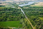 Szentes, Szentes city, Csongrad county, railway, concrete, iron, rail, tracks, train, cranky, crooked, devious, sinuous, winding, agitated, troubled, obscure, roily, , duckweed, vehicular, road bridge, railway bridge, bridge, bridges, forest, tree, trees, Tisza, Kurca, fair Tisza, green, slob, coast, inundation, flood, high tide, high water, low tide, low water, agriculture, farmlands, farmland, field, sunshine, sunlight, summer, spring, aerials, aerial, birds eye view, garden, environment, ambience, plan, air, air photograph, of birds eye view, CD 0029, Kiss L�szl�, L�szl� Kiss