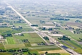 highway, road making, air photograph, road, M5, E5, E75, Szeged, Budapest, air photo, Kecskemet, Kiskunfelegyhaza, Hungary, transportation, traffic, horticulture, barrier, bar, fence, birds eye view, banister, delimination, bridge, holiday home, holiday resort, holidaymakers, house, houses, overpass, perspective, nature, bridges, power-line, wire, fruit tree, plantation, electric line, car, cars, lane, lanes, painted lane, speed, range of speeds, fast, fast transportation, menacing, cloud, clouds, sky, cut, dike, ditch, pit, trench, water-jump, asphalt, bitumen, blacktop, concrete, standing, arc of a circle, arc, Kiss L�szl�, L�szl� Kiss