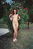 nudism, naturist lady, young nudist, naked girl, nude, nudity, attitude, pose, posture, to pose, rose, rose bush, red, redrose, unclad, stripped, tattooed, girl with a flower, taking photographs, young naturists, nudist girl, naked, unclothed, pretty, nudist, fkk, INF, naturism, naturist, woman, young, in a state of nature, in the buff, in the nude, garden, Delegyhaza, CD 0094, in front of rose bush