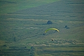 field, paragliding, paratrooper, jumping, parachute, parachutist, hill, hillside, countryside, nature, forest, grass, tree, green, arable, clod, earth, ploughland, tillage, meadow, range, pasture, grazer, parking, near, past, tower, television, bushes, trees, mountain, touch-down, to climb down, landing, to circle round, to lift off, to the left, thermic, yellow, to the right, down, up, Tokaj, clearing, glade, running leap, run up to, heater, headwind, wind, eye, front of, blow, lifting, brave, sport, evening, sunset, sky, lakes, behind we legs, cut-off lands, tables, agriculture, agricultural land, road, critter, haze, steam, vapor, fog, standing, plow, valley, cell, spare-time, leisure, time, alone, base running jump, hardy, Kiss L�szl�, L�szl� Kiss