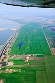Szeged, Feherto, White lake, lake, fishpond, water, inland inundation, plow, air photograph, air photo, air photos, aerials, aerial, Hungary, white, blue, field, arable, clod, earth, ploughland, tillage, island, farms, homestead, parcel, soil, ground, agriculture, cultivation, grower, grass, green, nature, natural, air, of the air, plan, map, fishery, fishing, farm, sheds, house, houses, road, dirt road, table, wheatfield, CD 0029, Kiss Lszl, Lszl Kiss