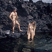 nudist couple, nudist pair, naked, stripped, naturist couple, naturist, holidays, nudist, on holiday, recreation, relaxation, repose, rest, rock coast, game, beach, coast, nudism, naturism, attitude, pose, posture, stony, craggy, bay, gulf, clear, hygienic, pure, clean, Hawaii, Kona, Honokohau, Queen s bath, 1987, man, woman, bath, bath, bathe, bathing, water, stone, stones, rock, scrag, bush, CD 0091
