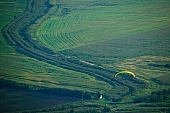paraglide, paragliding, green, birds eye view, plan, Tokaj, map, valley, plow, field, base running jump, jumping, glider, parachute, parachutist, paratrooper, hill, hillside, countryside, nature, forest, grass, tree, river, bridge, gateway, barrier, bar, curve, bend, engine-house, strong current, electricity, wire, dangerous, water, arable, clod, earth, ploughland, tillage, meadow, range, pasture, grazer, parking, near, past, tower, television, bushes, trees, mountain, touch-down, to climb down, landing, to circle round, to lift off, to the left, thermic, yellow, to the right, down, up, clearing, glade, running leap, run up to, heater, headwind, wind, eye, front of, blow, lifting, brave, sport of the brave, sport, evening, sunset, sky, lake, lakes, behind we legs, cut-off lands, tables, agriculture, agricultural land, road, car, house, shed, grapes, vineyards, vineyard, critter, haze, steam, vapor, fog, hardy, spare-time, leisure, time, Kiss L�szl�, L�szl� Kiss
