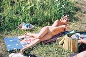 nudist women, to sun oneself, to sun, to sunbathe, towel, nudism, naturist, woman, naked, stripped, nude woman, sun, sunshine, naturism, russian, russian naturist, nudist, waterfront, in a state of nature, in the buff, in the nude, nudity, nude, nakedness, body, nature, outdoors, without doors, recreation, relaxation, repose, rest, entertainment, grass, in the grass, Moscow, Russia, CD 0097