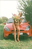 naturist, naturist beach, congratulation, car, in front of car, red car, chalice, girl, bouquet, blossom, bloom, flower, award, sun, sunshine, friend, scale, stairway, girlfriend, brown, skin, sunlit, delight, smile, unclad woman, woman, INF, taking photographs, attitude, pose, nude, nudity, naked girl, unclad body, young naturists, naked body, nude body, nudist place, fkk, posture, naturist girl, in a state of nature, in the buff, in the nude, naturism, unclad, stripped, nudist, nudism, young, naked, recreation, relaxation, repose, rest, camping, beach, Delegyhaza, CD 0095