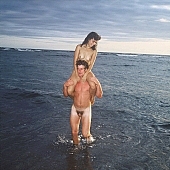fkk, naked, stripped, naturist, INF, Queen s bath, Honokohau, naturist pair, family, summer, recreation, relaxation, repose, rest, unclad, sea, billows, deep, cloud, clouds, sand, evening, sunset, nightfall, plant, woman, pair, man, friend, people, CD 0070