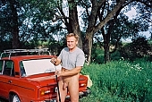 car, Lada, red car, red, nudist man, fisher, trolling-rod, fish, reel, line, blue sky, cloud, river, INF, riverside, in a state of nature, in the buff, in the nude, nudity, nude, nakedness, body, russian naturist man, nudism, naturist, man, naked, stripped, nude man, sun, sunshine, naturism, russian, russian naturist, nudist, waterfront, nature, outdoors, without doors, recreation, relaxation, repose, rest, entertainment, grass, in the grass, Moscow, Russia, CD 0097