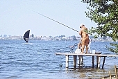 naturist, nudist, Hungary, Delegyhaza, 1988, naturist woman, naturist man, nudist man, naturist family, young, mother, surf, youthfulness, sun, sunlight, sun-bathing, sunbathing, recreation, relaxation, repose, rest, fisher, angling, disengagement, distraction, resource, nature, summer, holidays, fry, swelter, health, loose, joyful, joyfully, glad, as brown as a berry, near nature, beach, waterfront, lake, lake side, field naturist, fish, blue, scoop net, net, pier, chairs, CD 0037