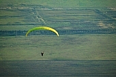 field, paragliding, paratrooper, jumping, parachute, parachutist, hill, hillside, countryside, nature, forest, grass, tree, green, arable, clod, earth, ploughland, tillage, meadow, range, pasture, grazer, parking, near, past, tower, television, bushes, trees, mountain, touch-down, to climb down, landing, to circle round, to lift off, to the left, thermic, yellow, to the right, down, up, Tokaj, clearing, glade, running leap, run up to, heater, headwind, wind, eye, front of, blow, lifting, brave, sport, evening, sunset, sky, lakes, behind we legs, cut-off lands, tables, agriculture, agricultural land, road, critter, haze, steam, vapor, fog, standing, plow, valley, spare-time, leisure, time, cell, flying, base running jump, hardy, river, Kiss Lszl, Lszl Kiss