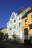 Szeged, town, city, street, house, houses, green, white, yellow, red, tree, trees, sky, canopy of heaven, cope of heaven, firmament, blue, blue sky, power-line, electric line, perspective, light, sunlight, sunshine, standing, condominium, condo, big house, renewes, renovated, painted, freshly painted, pavement, side-walk, sidewalk, narrow street, alley, mediterranean, city sight, slant, slanting, architecture, Kiss Lszl, Lszl Kiss